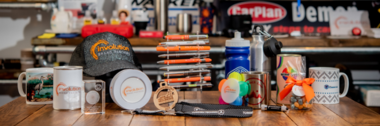 Branded merchandise including mugs, caps, bottles and pens