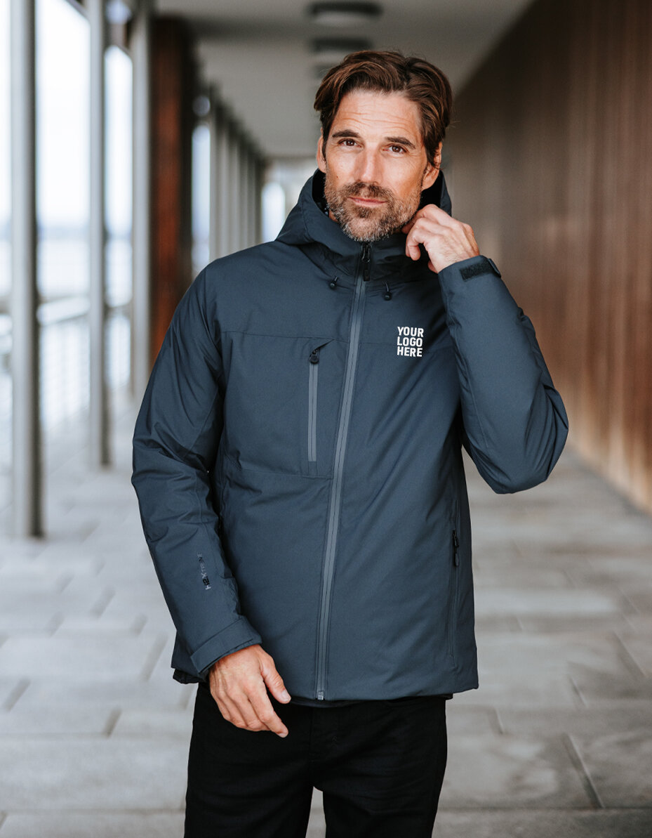 Man in a Stormtech bodywarmer on a beach